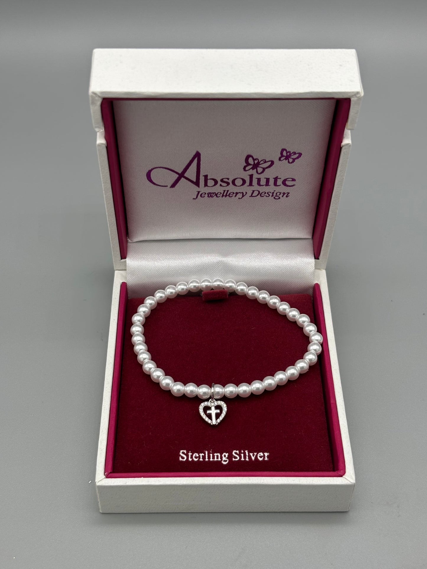Children's Silver pearl bracelet with heart/cross charm