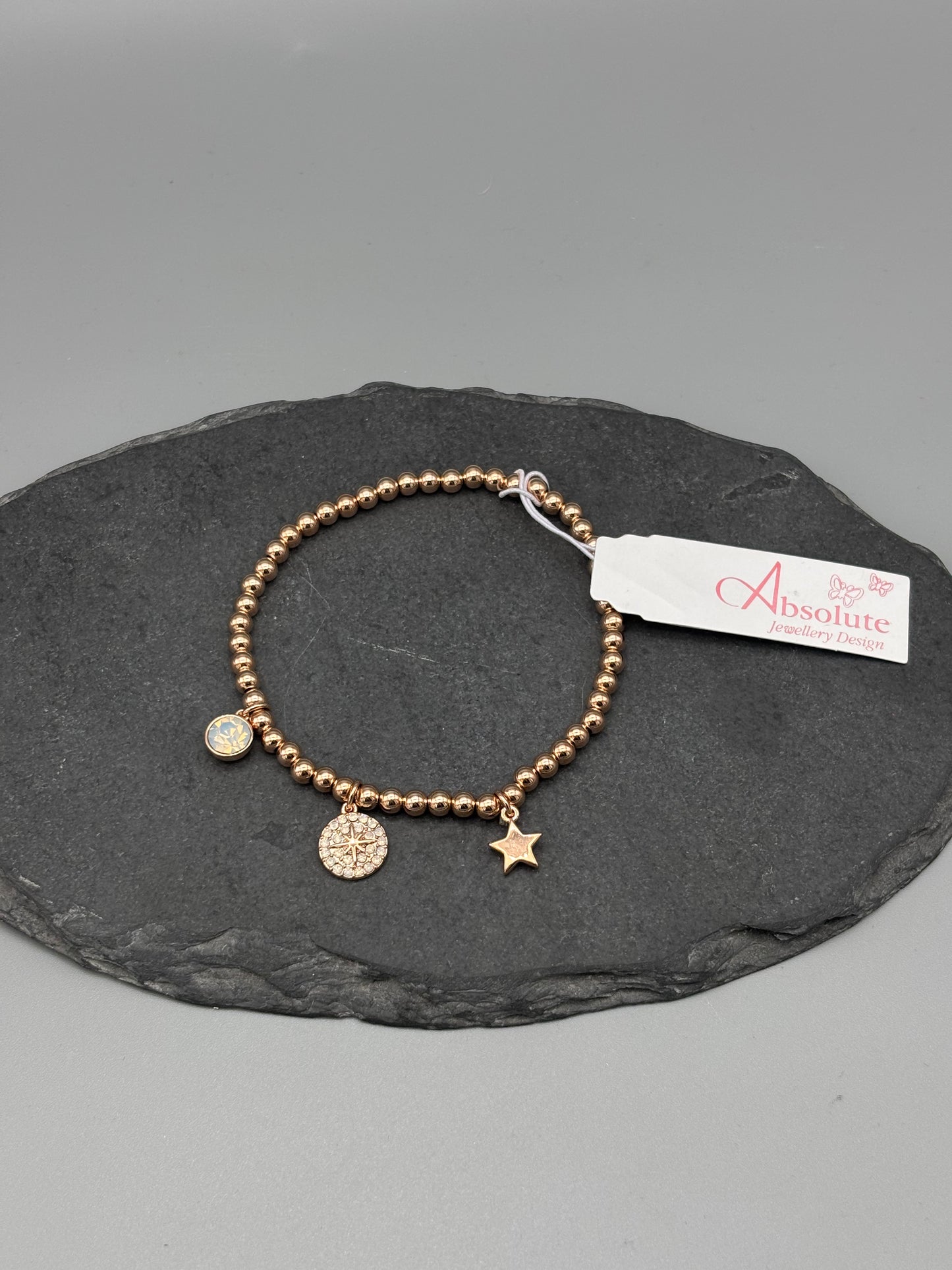 Absolute rosegold bracelet with mother of pearl / charms