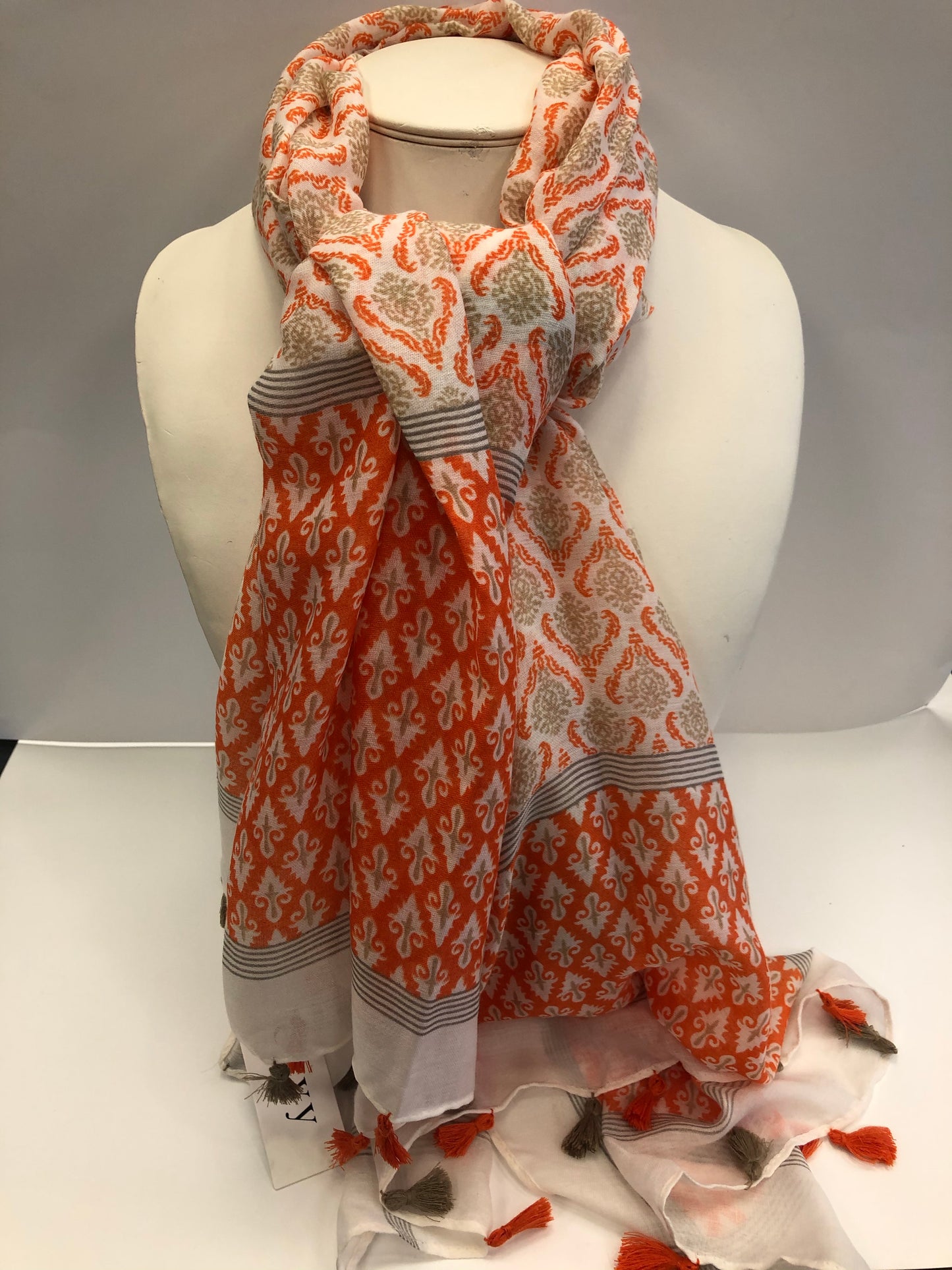 Stylish Orange Envy scarf with tassels