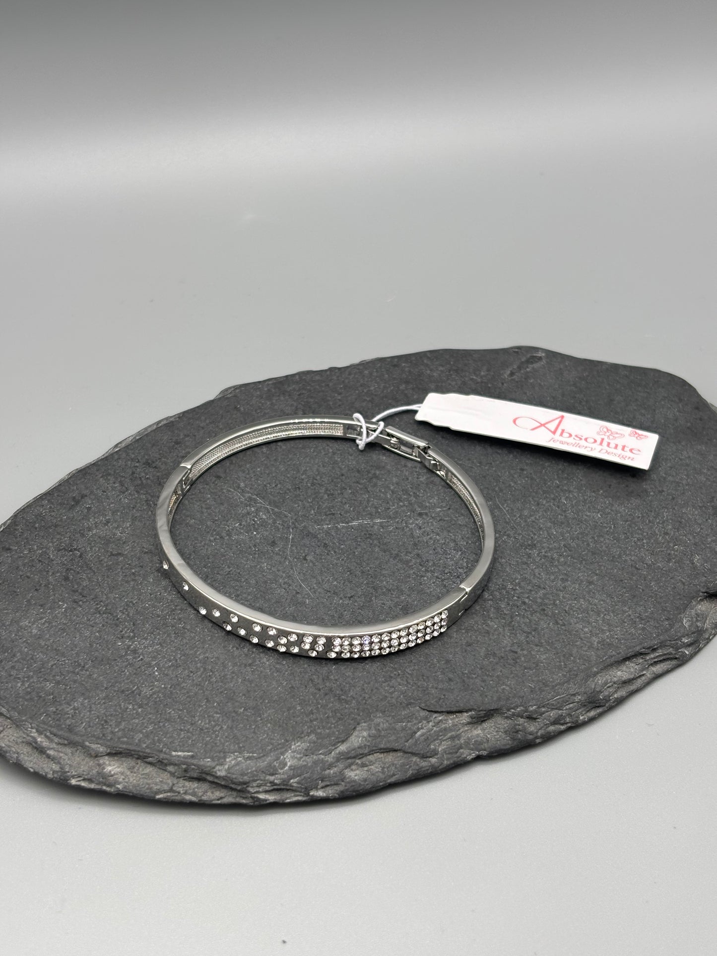 Absolute silver bangle with inset cubic zirconia stones